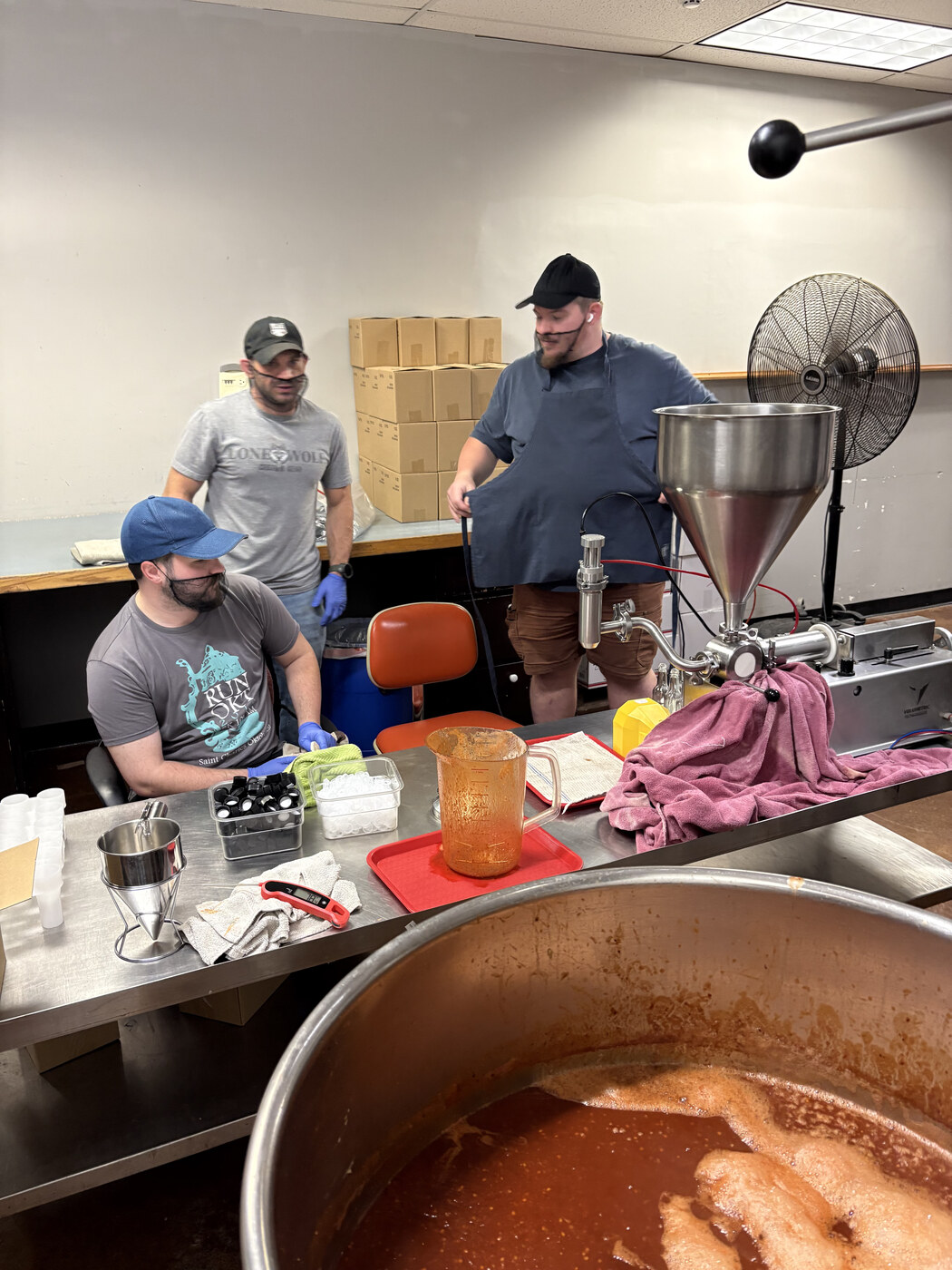 Erik, Gabe, and Matthew bottling